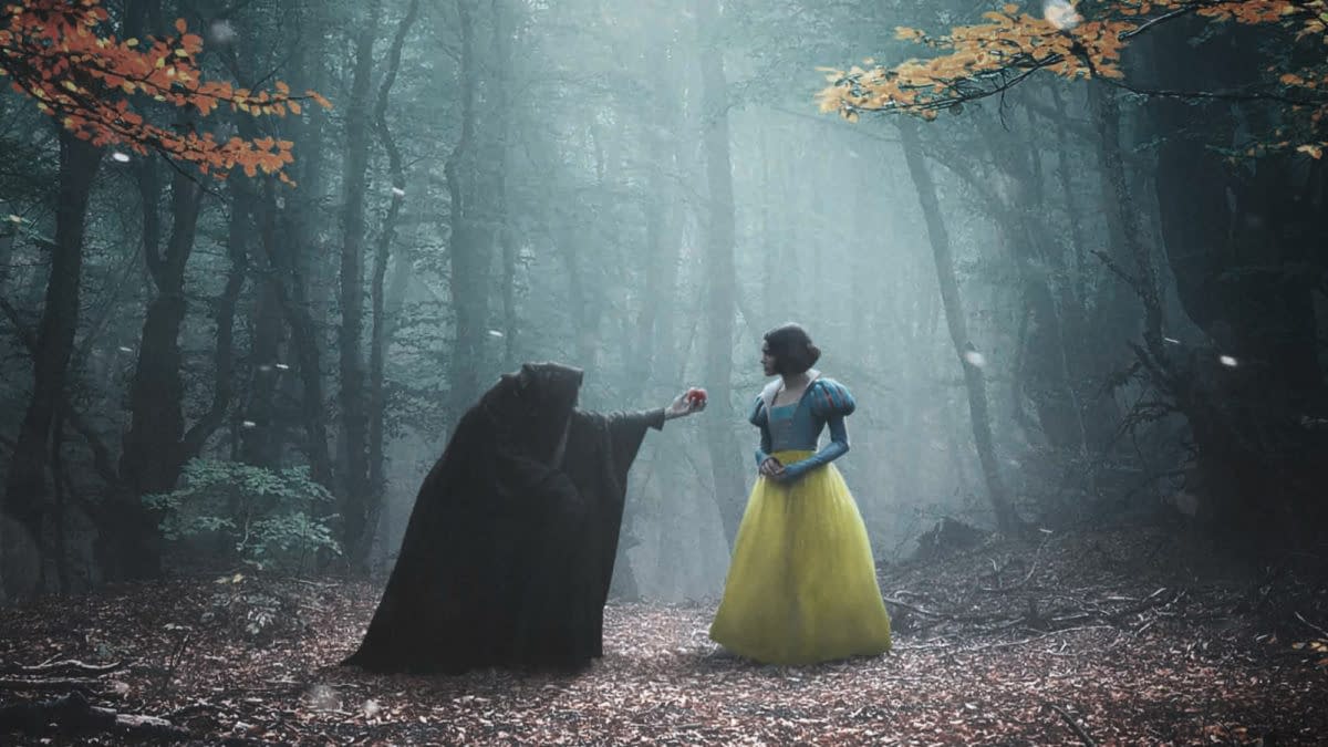 A dramatic illustration featuring Snow White in a colorful yellow dress and a blue bodice, standing in a misty forest. An ominous cloaked figure offers her a red apple, highlighting a moment of tension.