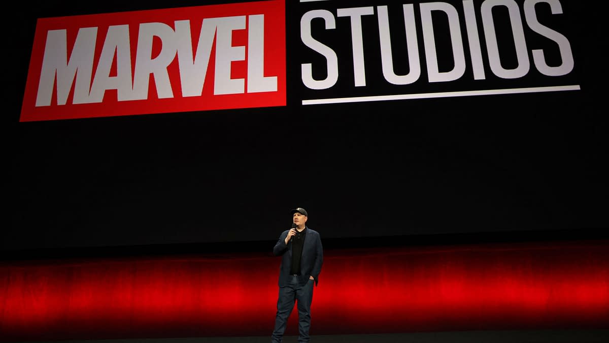Kevin Feige, President of Marvel Studios, speaks on stage against a backdrop displaying the Marvel Studios logo during the Walt Disney Studios presentation at CinemaCon 2024 in Las Vegas.