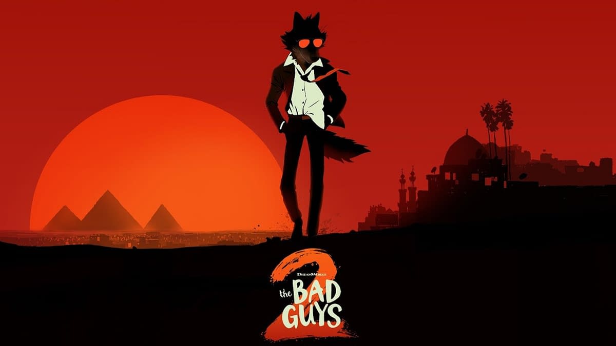 A stylized illustration from 'The Bad Guys 2,' featuring a cool wolf-like character wearing sunglasses and a suit, standing confidently against a striking red sunset with silhouette representations of pyramids and palm trees in the background.