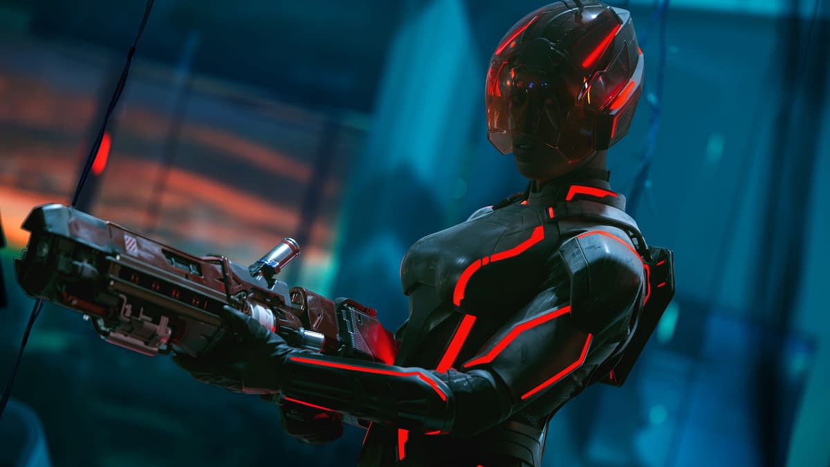 Jodie Turner-Smith as Athena in a futuristic suit with glowing red accents, holding a weapon, set against a high-tech background in a scene from Disney's Live Action TRON: ARES.