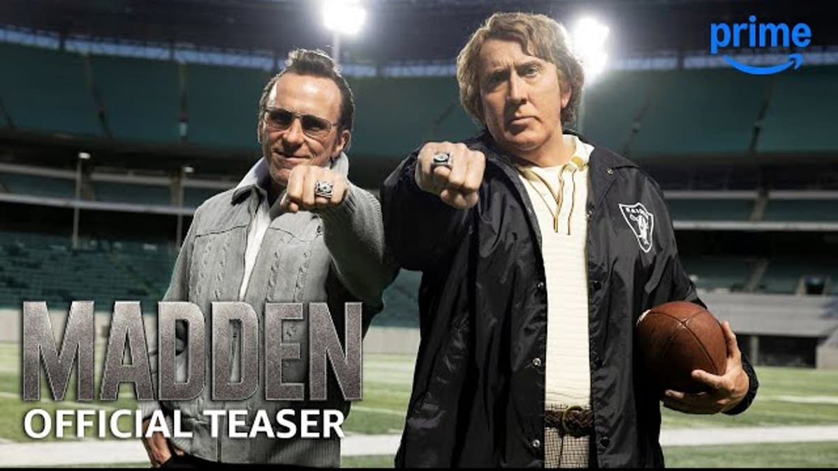 A scene from the teaser for 'Madden' featuring two male characters posing on a football field, one holding a football and both showing off their championship rings, with the title 'MADDEN OFFICIAL TEASER' at the bottom.