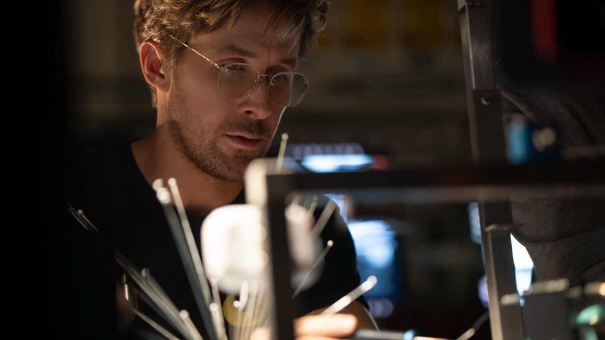 Project Hail Mary Ryan Gosling portrays Ryland Grace in a scene from 'Project Hail Mary,' focusing intently on scientific equipment amid a dimly lit environment.