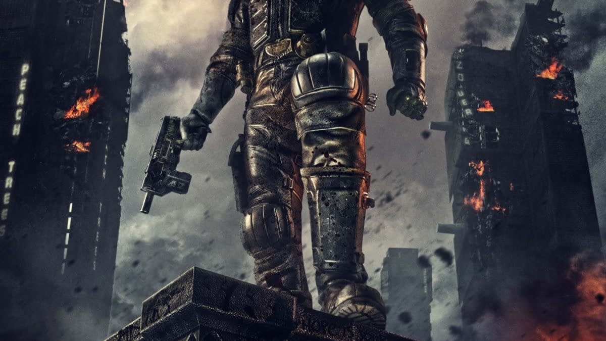 A dramatic poster for the film 'Dredd', featuring a futuristic law enforcer in armored gear, standing confidently amidst a smoky, burning urban landscape. The text 'Judgment is Coming' is prominently displayed above him, with the film's title 'Dredd 3D' at the bottom.