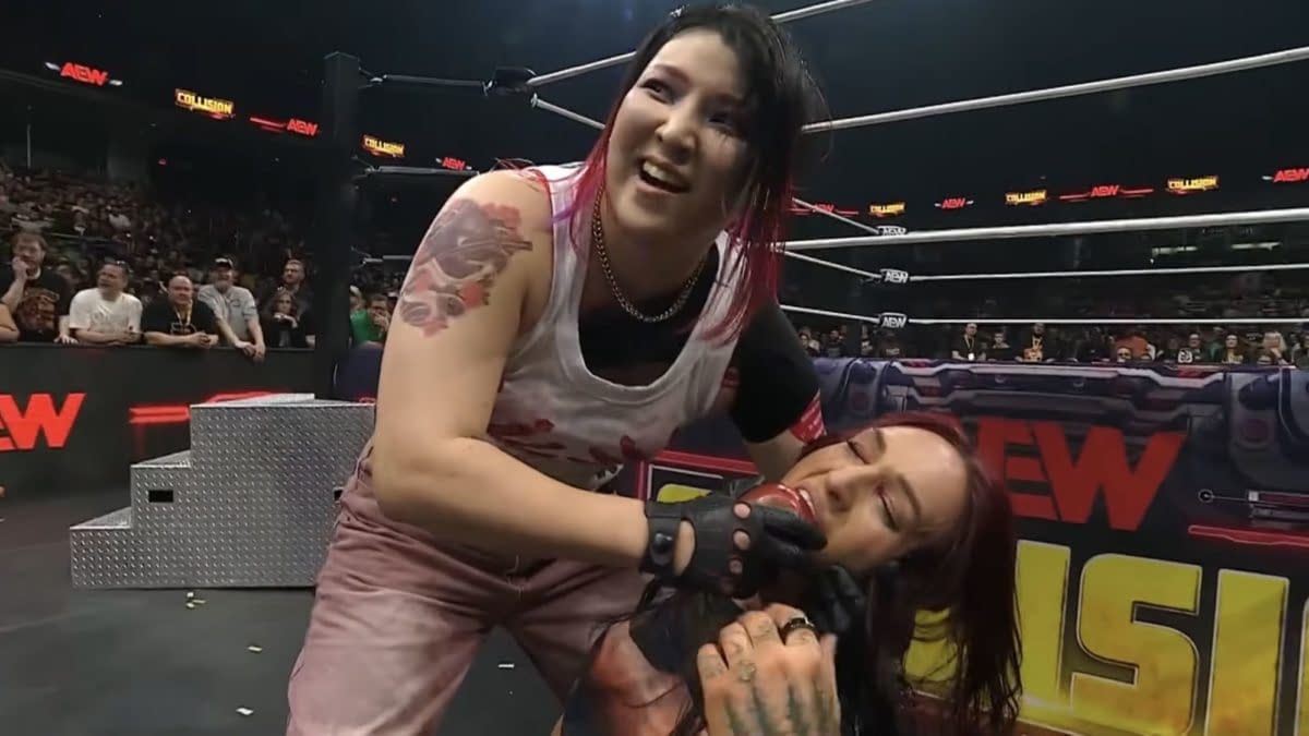 Hikaru Shida offers Kris Statlander a snack while the two wrestle ringside during an AEW Lights Out match in Philadelphia.