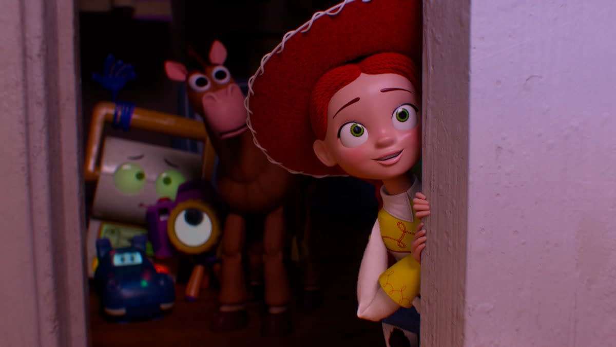 Jessie peeks around a doorway while Bullseye and several new toy characters watch from the dark in Disney and Pixar’s Toy Story 5.