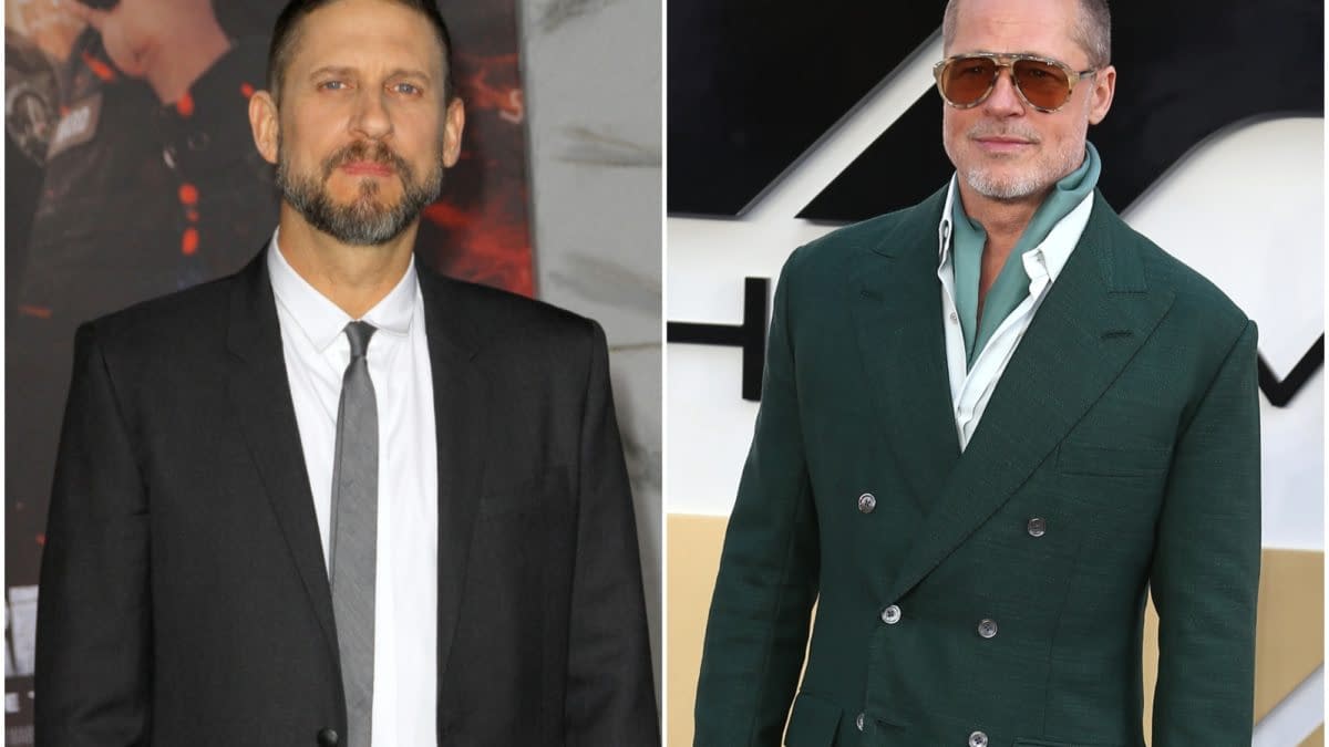 Side-by-side portrait of filmmaker David Ayer and actor Brad Pitt at a red-carpet event. Ayer wears a black suit and tie, while Pitt wears sunglasses and a dark green suit.