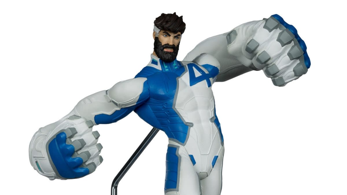 McFarlane Toys Marvel Rivals Mister Fantastic 1:6th figure posed with oversized, stretched fists in a blue and white suit.