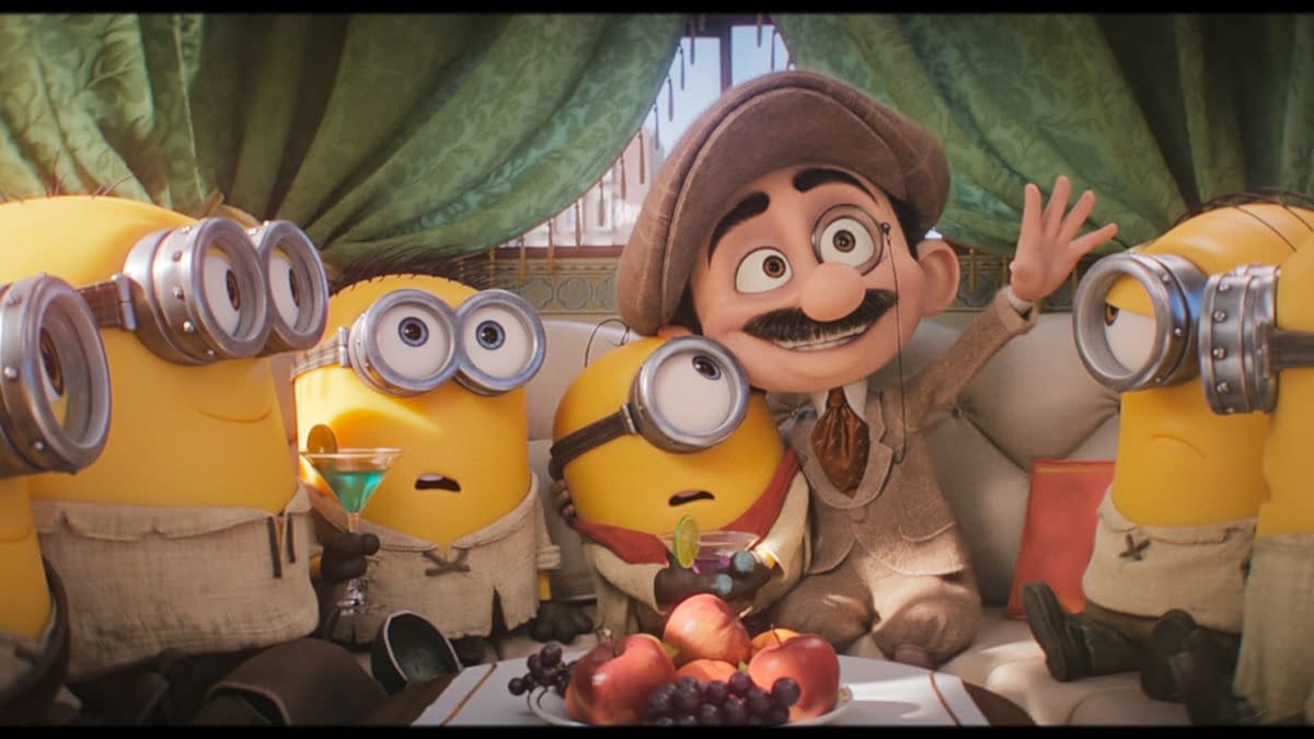 Animated Minions & Monsters scene showing several Minions riding in a limo with a mustached man in a suit and hat, holding drinks and waving.