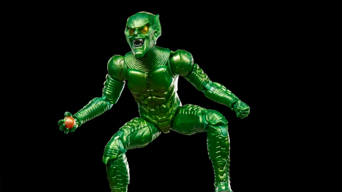 A green Marvel Legends Green Goblin action figure posed against a black background, holding a pumpkin bomb in one hand. The figure is shown in a crouched, menacing stance.