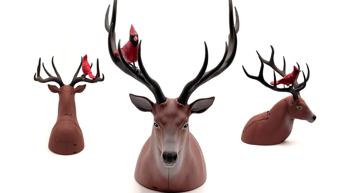 Three views of a deer-shaped card dispenser or popcorn bucket with large antlers and a red cardinal perched on top, shown on a white background.