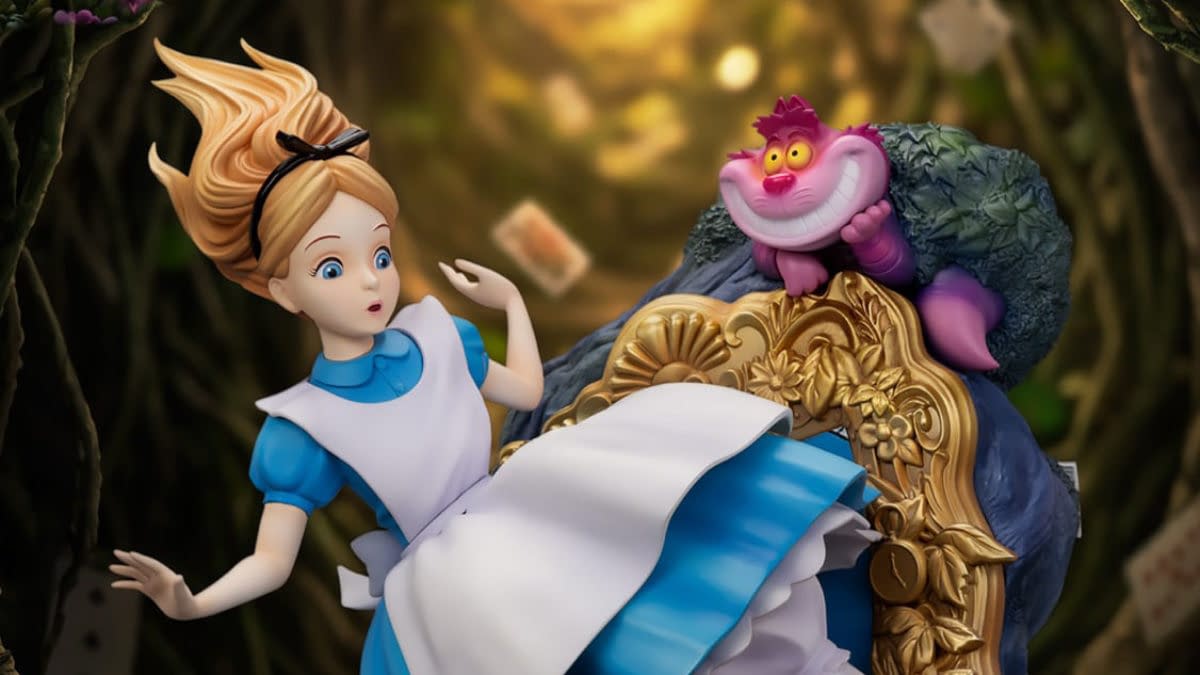 Beast Kingdom Disney Alice in Wonderland statue featuring Alice startled beside the Cheshire Cat perched on an ornate chair. The collectible figure is posed against a dark, whimsical forest backdrop.