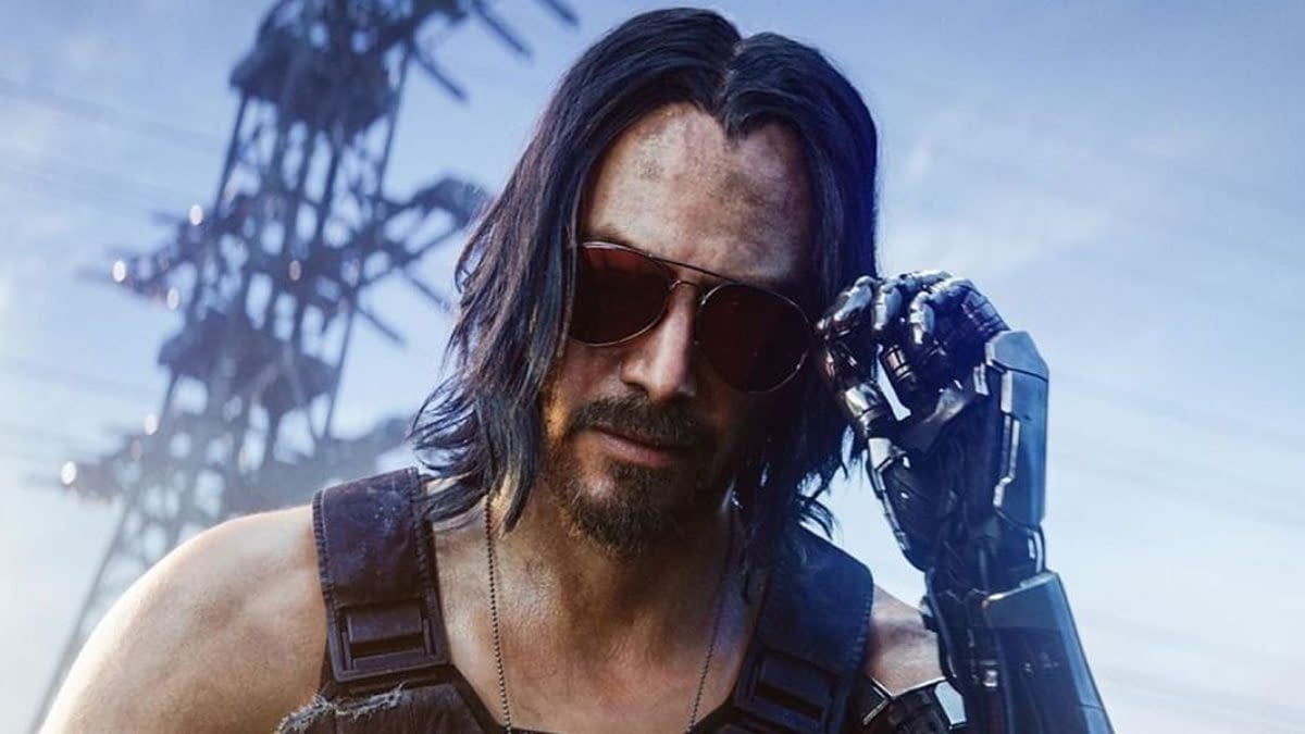 Keanu Reeves as Johnny Silverhand in Cyberpunk 2077, wearing sunglasses and a cybernetic arm against a futuristic industrial backdrop.