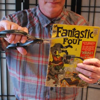 Cutting Up A Copy Of Fantastic Four #2 With Scissors