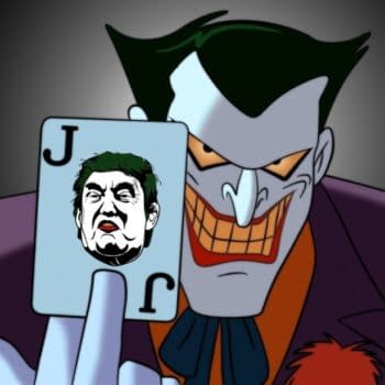 An image of The Joker holding aloft a playing card with a picture of Donald Trump's face on it.