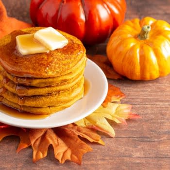 A Stack of Pumpkin Spice Flavored Pancakes on a Wooden Table. By P Maxwell Photography.