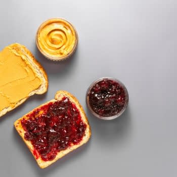 Sandwiches or bread toast with peanut butter and fruit jelly. Flat lay. By Erhan Inga
