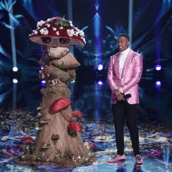 THE MASKED SINGER: L-R: Mushroom with host Nick Cannon in the “The Group C Play Offs - Funny you should Mask” episode of THE MASKED SINGER airing Wednesday, Nov. 4 (8:00-9:00 PM ET/PT) on FOX. © 2020 FOX MEDIA LLC. CR: Michael Becker/FOX.
