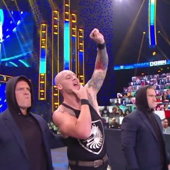 The Ratings King of Friday Nights, Baron Corbin, stands triumphant over The CW's stupid Christmas shows [WWE Smackdown Screencap]