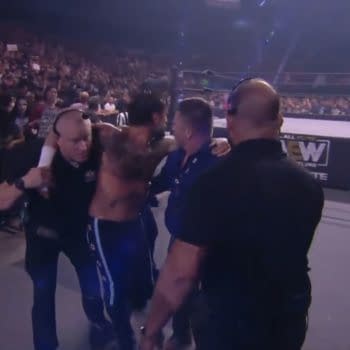 CM Punk is helped backstage after losing the AEW World Championship to Jon Moxley