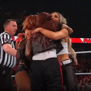 Trish Stratus hugs Lita and Becky Lynch after helping them win the Tag Team Titles on WWE RAw