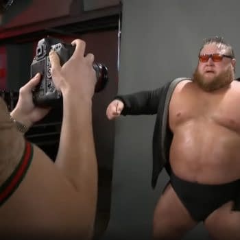 Otis poses for a photo shoot with Maximum Male Models on WWE Raw