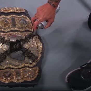 CM Punk paints the Twitter logo on his AEW Championship on AEW Collision