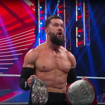 Finn Balor celebrates as Judgment Days wins the tag titles on WWE Raw