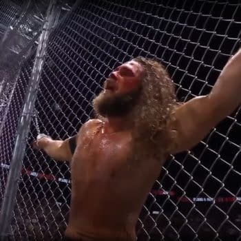 Jack Perry is handcuffed to the cage at AEW Dynamite: Blood & Guts