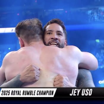 John Cena hugs Jey Uso in a touching moment after Uso wins the 2025 Men's Royal Rumble match.