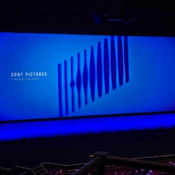 A stage backdrop displays the Sony Pictures logo and the text 'CINEMACON 2025' against a gradient blue background, with stylized shapes in the design. The overall atmosphere suggests a professional presentation at a cinema event.