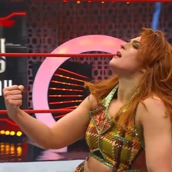 Jamie Hayter celebrates her victory with a triumphant pose in the wrestling ring after defeating Billie Starks during AEW Collision. The background features AEW branding, enhancing the event's atmosphere.