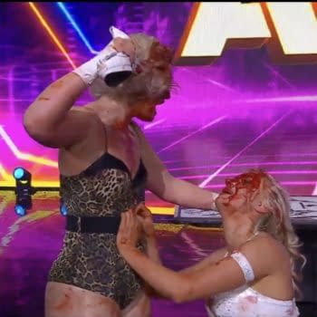 A bloodied Toni Storm prepares to beat Mariah May with a shoe at AEW Revolution
