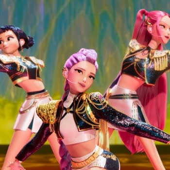 Animated illustration of three K-pop-inspired characters striking dynamic poses on stage, dressed in sparkly outfits with colorful hairstyles, set against a vibrant, fantasy-inspired background. The image represents the 'KPop Demon Hunters' theme, blending music and supernatural elements.