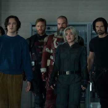 A group of six characters from Marvel Studios' 'Thunderbolts' stands in an indoor setting, showcasing a diverse range of outfits and expressions, highlighting their distinct personas. The characters appear to be united in purpose, creating a sense of tension and anticipation.