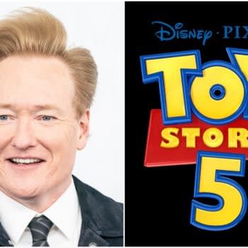 A cartoon logo for "Toy Story 5" featuring colorful, bold text that reads "Toy Story" with the number 5 below it. Next to the logo is a smiling man with light brown hair and a black jacket, representing a lively and cheerful atmosphere.