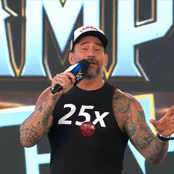 CM Punk, a professional wrestler with tattoos speaks into a microphone while wearing a sleeveless shirt with the number '25x' on it. He appears to be addressing an audience, with a colorful background featuring part of the WWE Night of Champions logo.