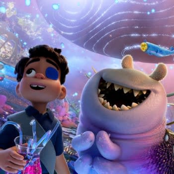 A vibrant animated scene featuring Elio, a young boy with a blue eye patch, joyfully holding a glass filled with colorful liquid. Beside him is Glordon, a large, friendly creature with a wide grin and sharp teeth, surrounded by an otherworldly landscape with floating jellyfish-like plants and whimsical alien beings.