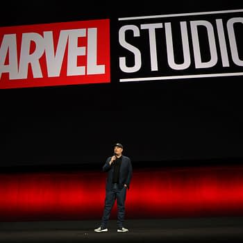 Kevin Feige, President of Marvel Studios, speaks on stage against a backdrop displaying the Marvel Studios logo during the Walt Disney Studios presentation at CinemaCon 2024 in Las Vegas.