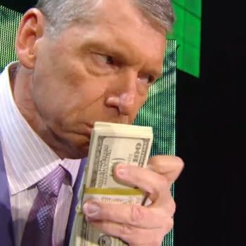 Vince McMahon, dressed in a suit, holds a stack of bills close to his face while expressing enjoyment on WWE Raw in 2008. The background features bright green lighting.