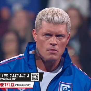 Cody Rhodes, sporting a blue jacket, stares intently while standing in a wrestling ring, with blurry crowd members in the background. The image promotes WWE SummerSlam events on August 2 and August 3, 2025.