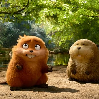 In Pixar's animation 'Hoppers', two charming characters, Mabel and Loaf, are depicted sitting on sandy ground near a serene water body surrounded by lush greenery. Mabel, with vibrant orange fur, and Loaf, with a softer beige tone, both display playful expressions.