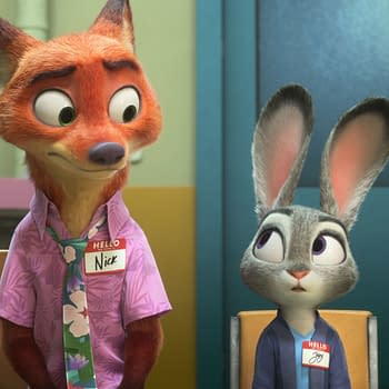 A cartoon scene from "Zootopia 2" featuring Nick Wilde, a fox with orange fur wearing a pink floral shirt and a name tag, sitting beside Judy Hopps, a gray rabbit with long ears wearing a blue shirt and a name tag. The background includes a colorful sign and various cups.