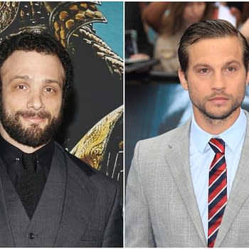 A split image featuring two actors: on the left, a man with a beard and curly hair, dressed in a dark suit, and on the right, a clean-shaven man in a light gray checked suit with a striped tie. This image relates to 'The Odyssey.'