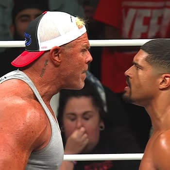 Billy Gunn yells intensely at Anthony Bowens in a wrestling ring during AEW Collision, highlighting a tense confrontation between the two wrestlers.