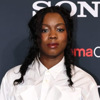 A young woman with braided hair wears a white button-up shirt and poses in front of a dark background featuring the 'Sony' logo and 'CinemaCon' text.