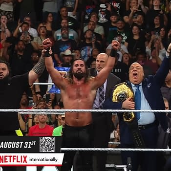 Seth Rollins and his friends celebrate in the wrestling ring after WWE Raw, with the crowd cheering in the background.
