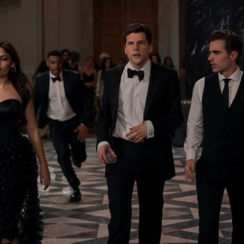 A scene from 'Now You See Me: Now You Don't' featuring characters June, Daniel Atlas, and Jack Wilder in elegant attire, surrounded by a lively crowd in a lavish setting.