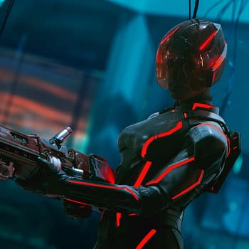 Jodie Turner-Smith as Athena in a futuristic suit with glowing red accents, holding a weapon, set against a high-tech background in a scene from Disney's Live Action TRON: ARES.