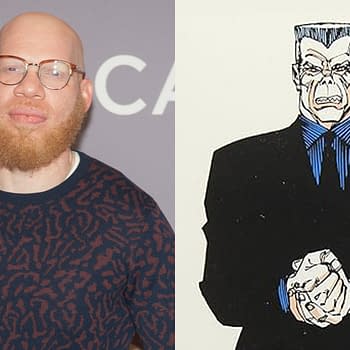 Marvin Jones III, wearing glasses and a patterned sweater, poses for the camera against a gray background at the SCAD aTV Fest 2018. Next to him is an illustration of the character Tombstone, depicted as a large, muscular man in a black suit with an aggressive expression.