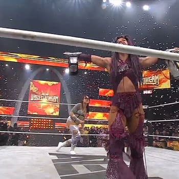 Kris Statlander appears in a wrestling ring at AEW WrestleDream, poised to confront Mercedes Moné, who holds the championship belt. Confetti is falling in the background as fans cheer.
